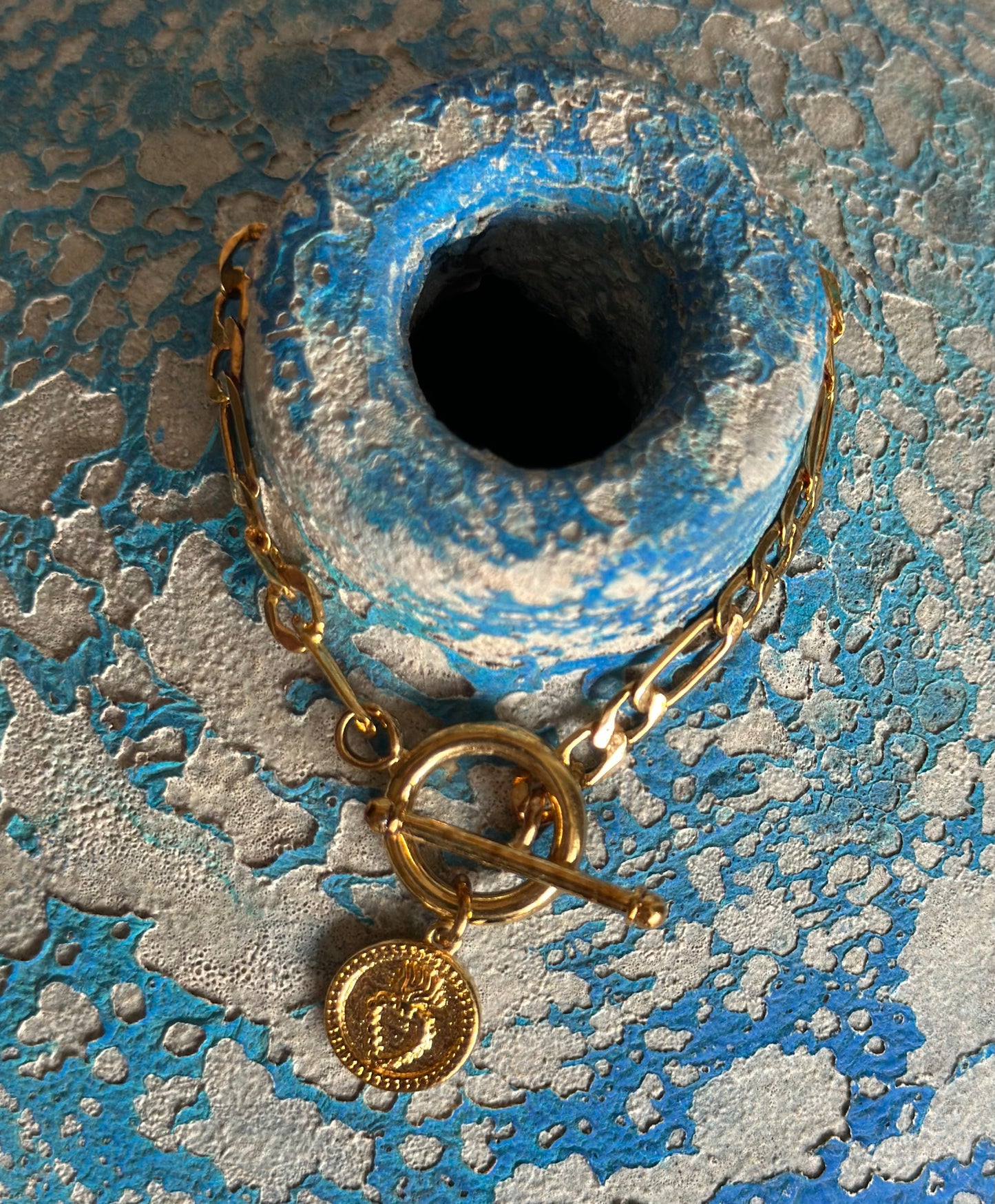 PULSERA CORAZÓN CRUZADO